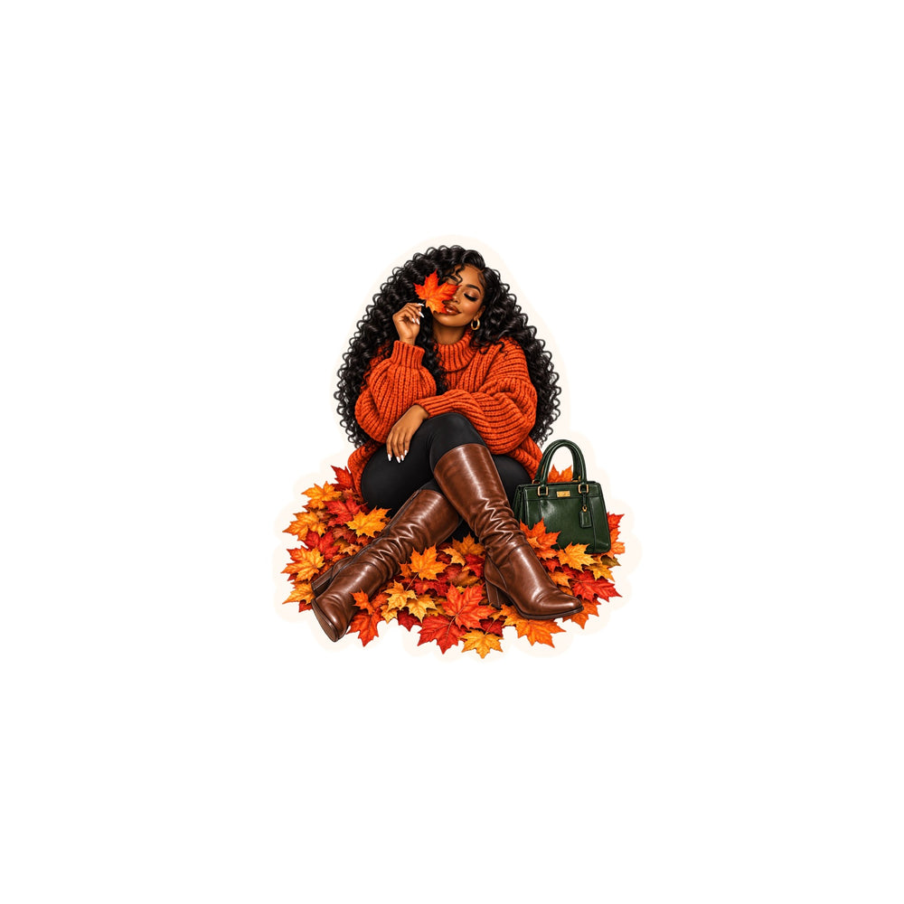 Stylish Black woman in an orange sweater sitting in autumn leaves