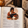 Cozy Covered & in the Word magnetic bookmark shown clipped inside an open Bible